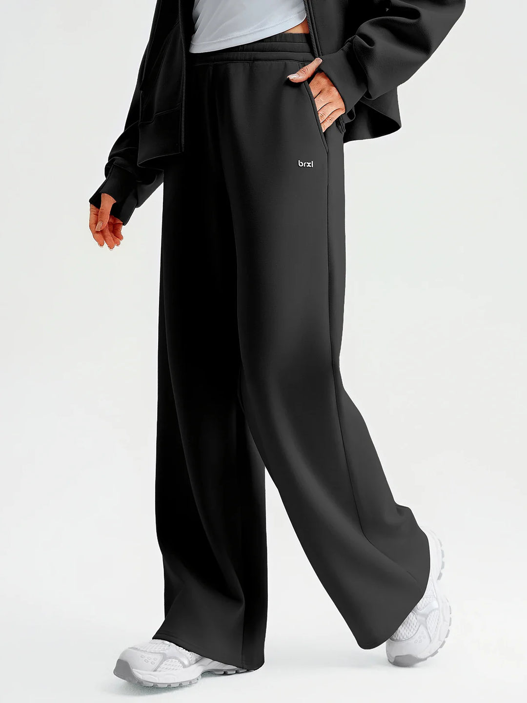 A model wearing a BRXL® Lightweight Mid-Rise Wide Leg Baggy Sweatpants