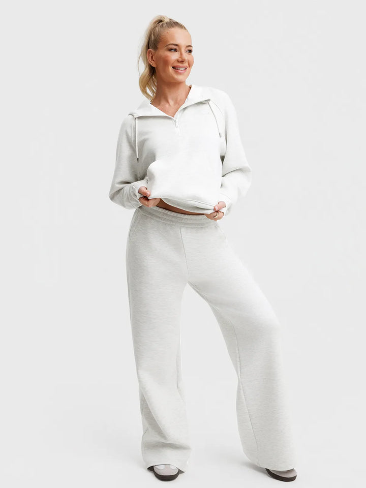 A model wearing a BRXL® Lightweight Mid-Rise Wide Leg Baggy Sweatpants
