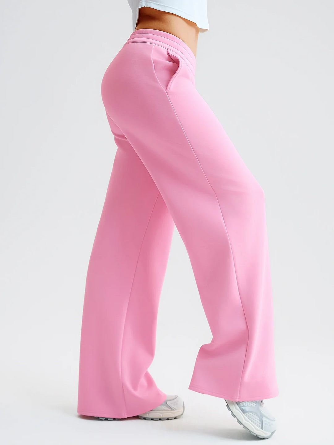 A model wearing a BRXL® Lightweight Mid-Rise Wide Leg Baggy Sweatpants