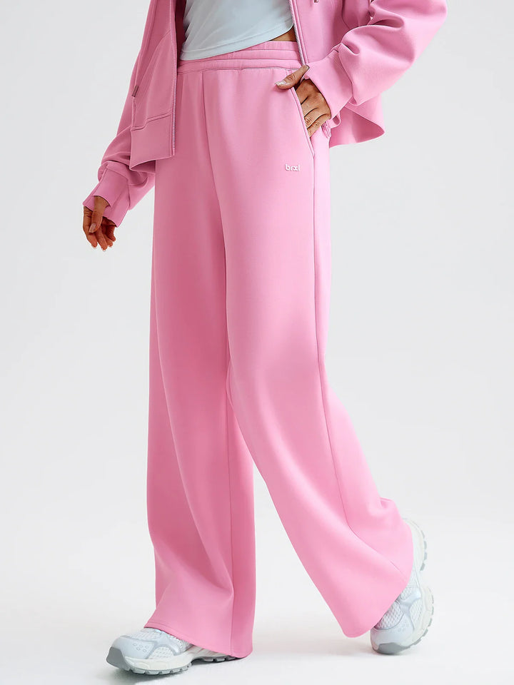 A model wearing a BRXL® Lightweight Mid-Rise Wide Leg Baggy Sweatpants