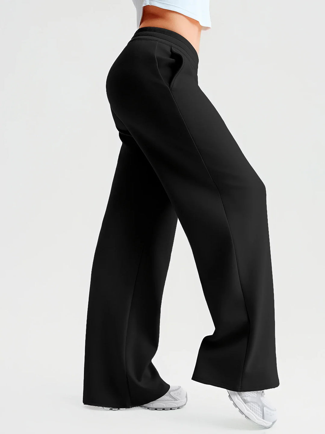 A model wearing a BRXL® Lightweight Mid-Rise Wide Leg Baggy Sweatpants