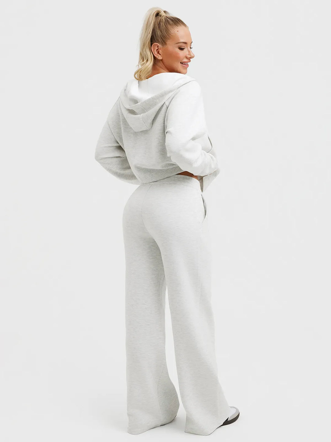 A model wearing a BRXL® Lightweight Mid-Rise Wide Leg Baggy Sweatpants