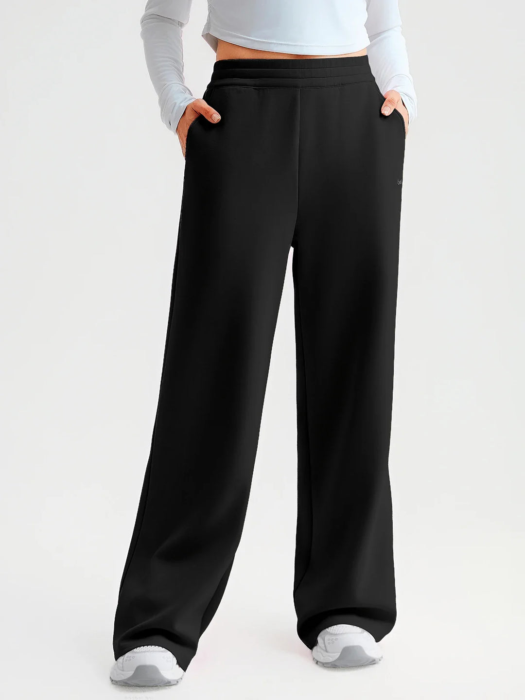 A model wearing a BRXL® Lightweight Mid-Rise Wide Leg Baggy Sweatpants