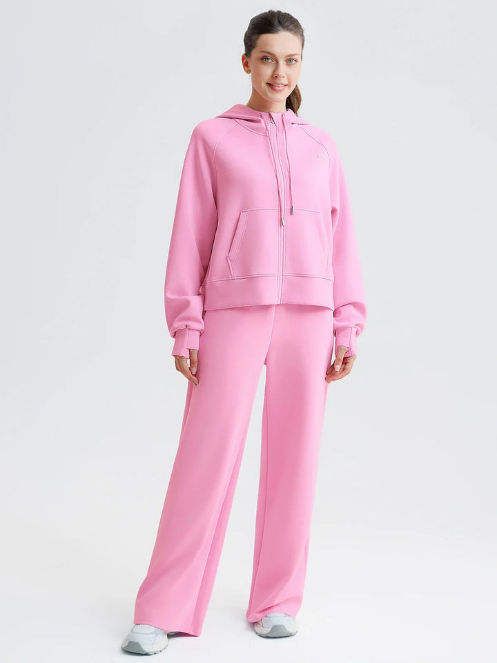 A model wearing a BRXL® Lightweight Mid-Rise Wide Leg Baggy Sweatpants