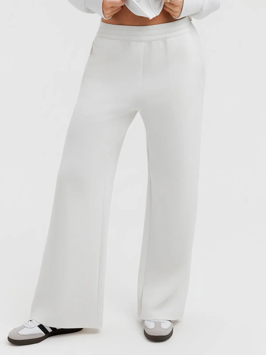 A model wearing a BRXL® Lightweight Mid-Rise Wide Leg Baggy Sweatpants White / XS