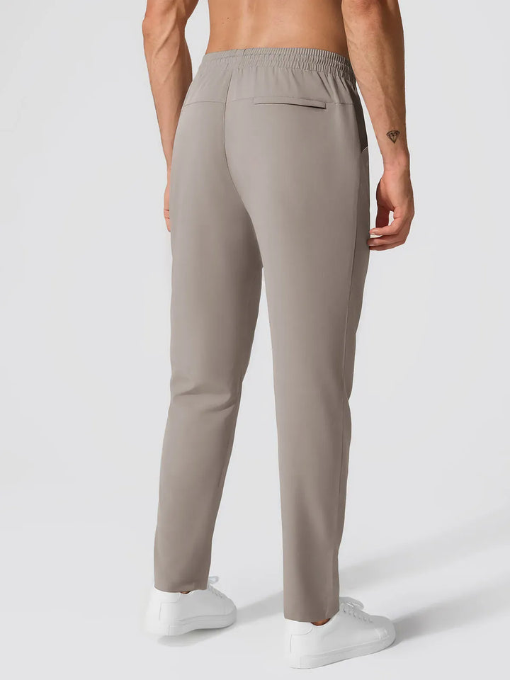 A model wearing a BRXL® Men’s  Adjustable Waist Tapered Activewear Joggers in