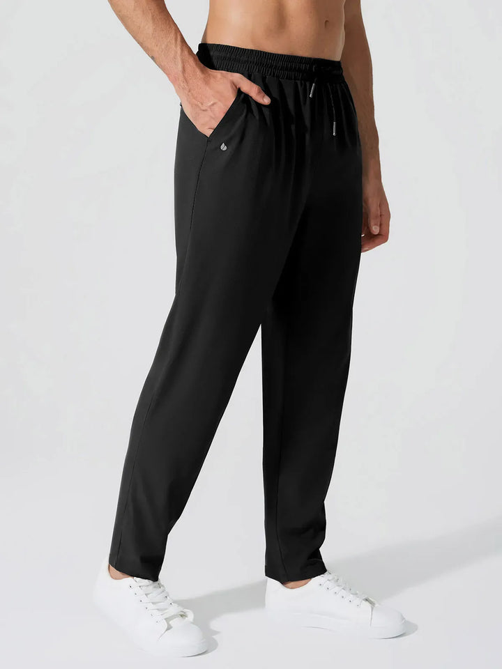 A model wearing a BRXL® Men’s  Adjustable Waist Tapered Activewear Joggers in