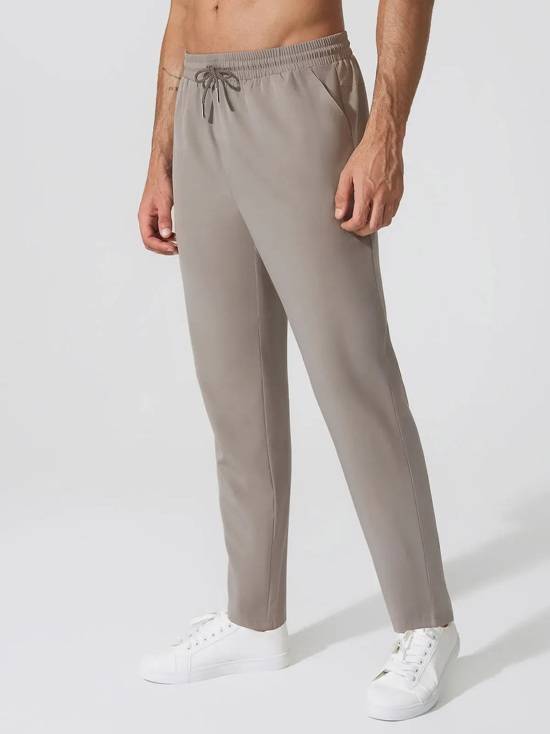 A model wearing a BRXL® Men’s  Adjustable Waist Tapered Activewear Joggers in Charcoal / S