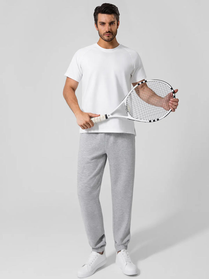 A model wearing a BRXL® Men's Four Pockets Drawstring Waist Activewear Sweatpants in