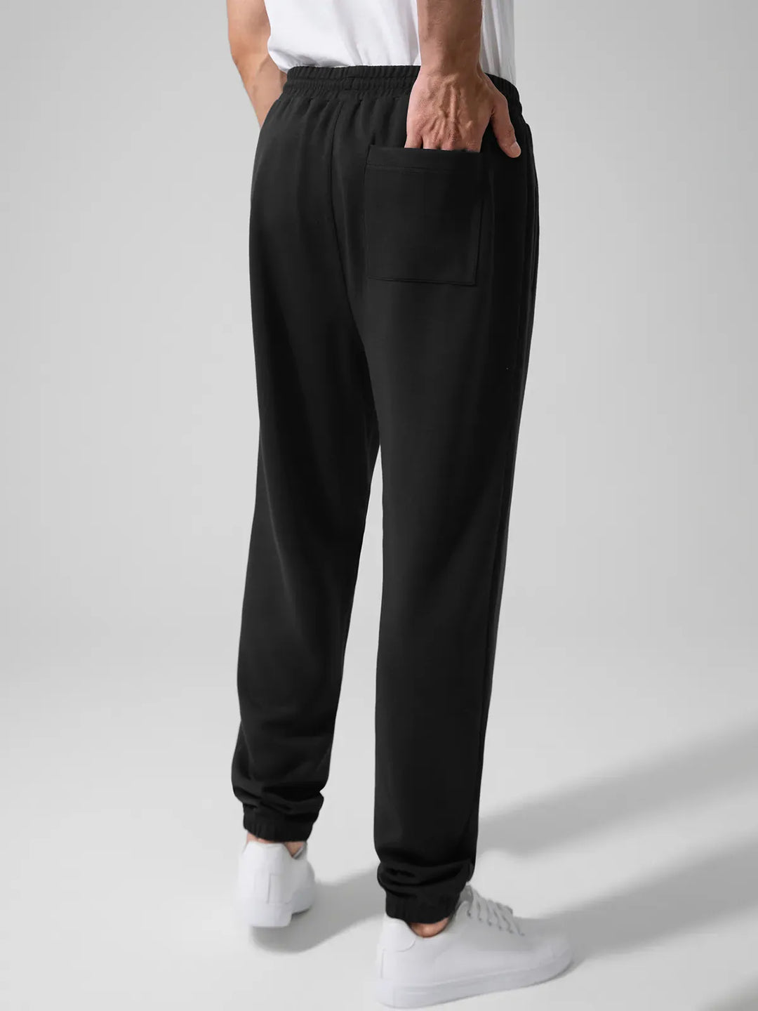 A model wearing a BRXL® Men's Four Pockets Drawstring Waist Activewear Sweatpants in