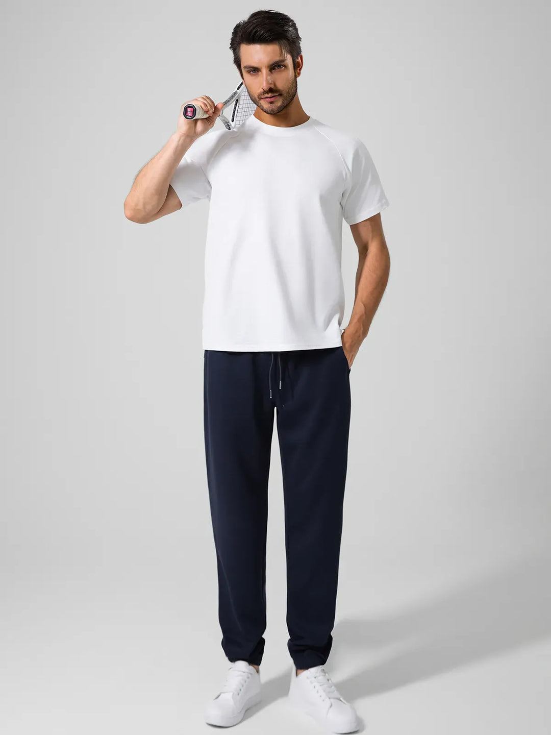 A model wearing a BRXL® Men's Four Pockets Drawstring Waist Activewear Sweatpants in