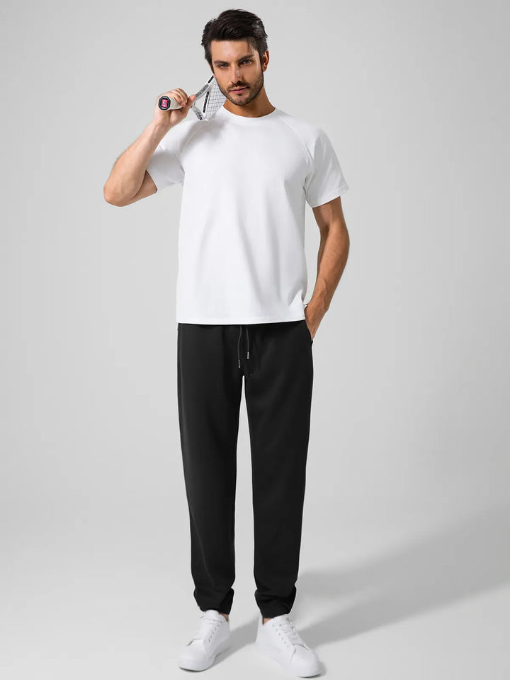 A model wearing a BRXL® Men's Four Pockets Drawstring Waist Activewear Sweatpants in