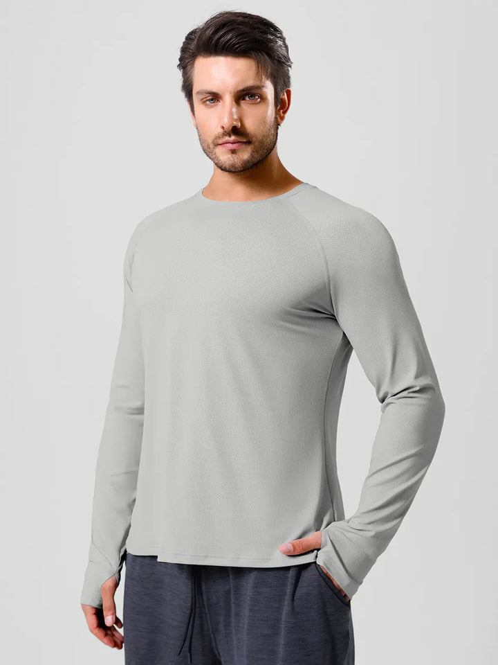 A model wearing a BRXL® Men’s Long Sleeve Thumbhole Activewear Shirt in