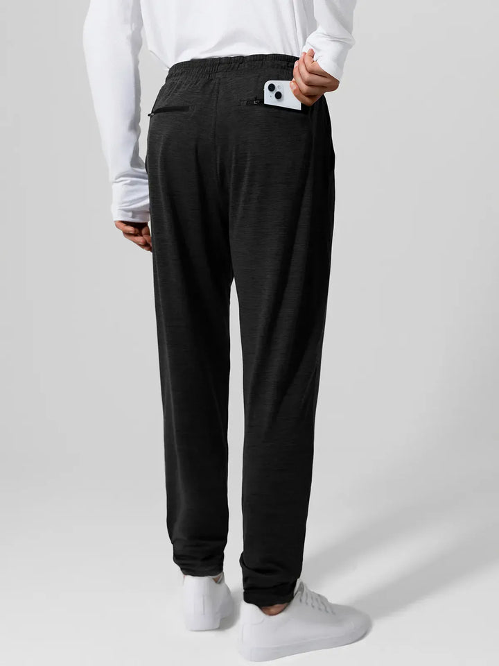 A model wearing a BRXL® Men’s Smooth Four Pockets Tapered Joggers in