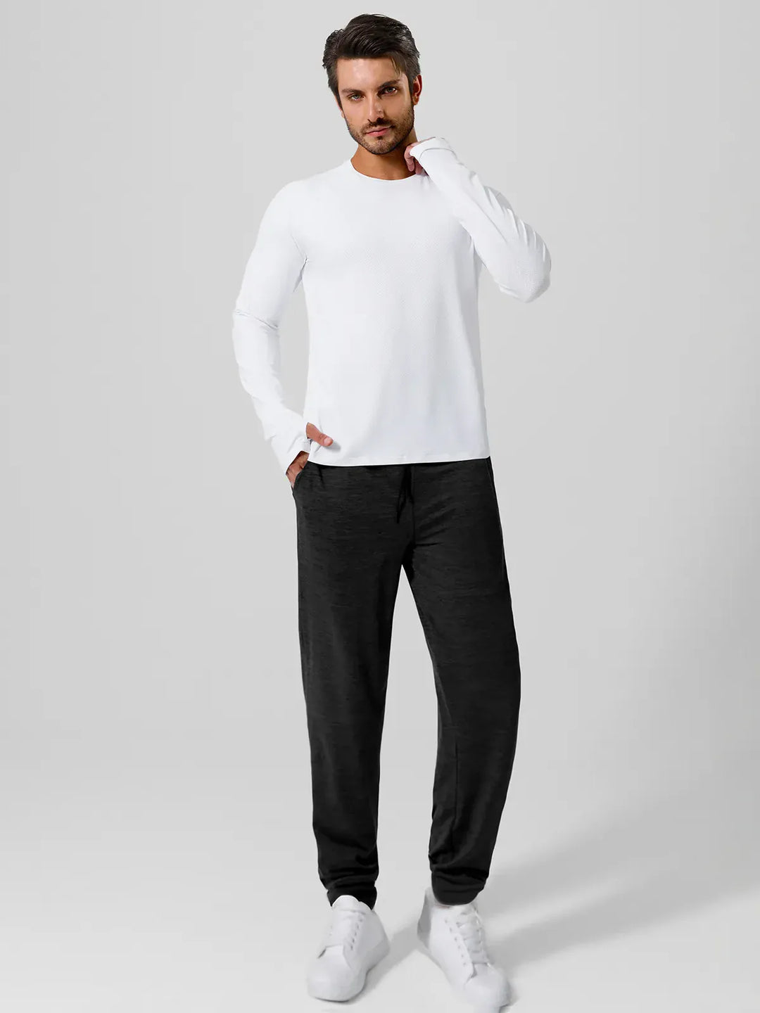 A model wearing a BRXL® Men’s Smooth Four Pockets Tapered Joggers in