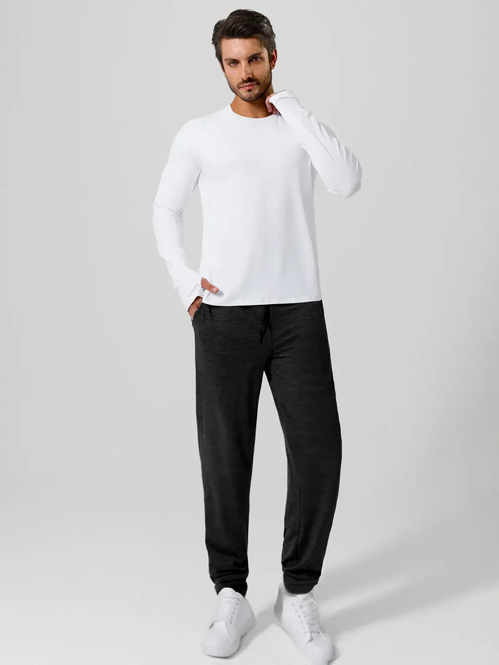A model wearing a BRXL® Men’s Smooth Four Pockets Tapered Joggers in