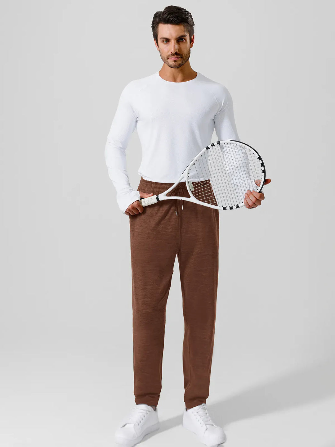 A model wearing a BRXL® Men’s Smooth Four Pockets Tapered Joggers in