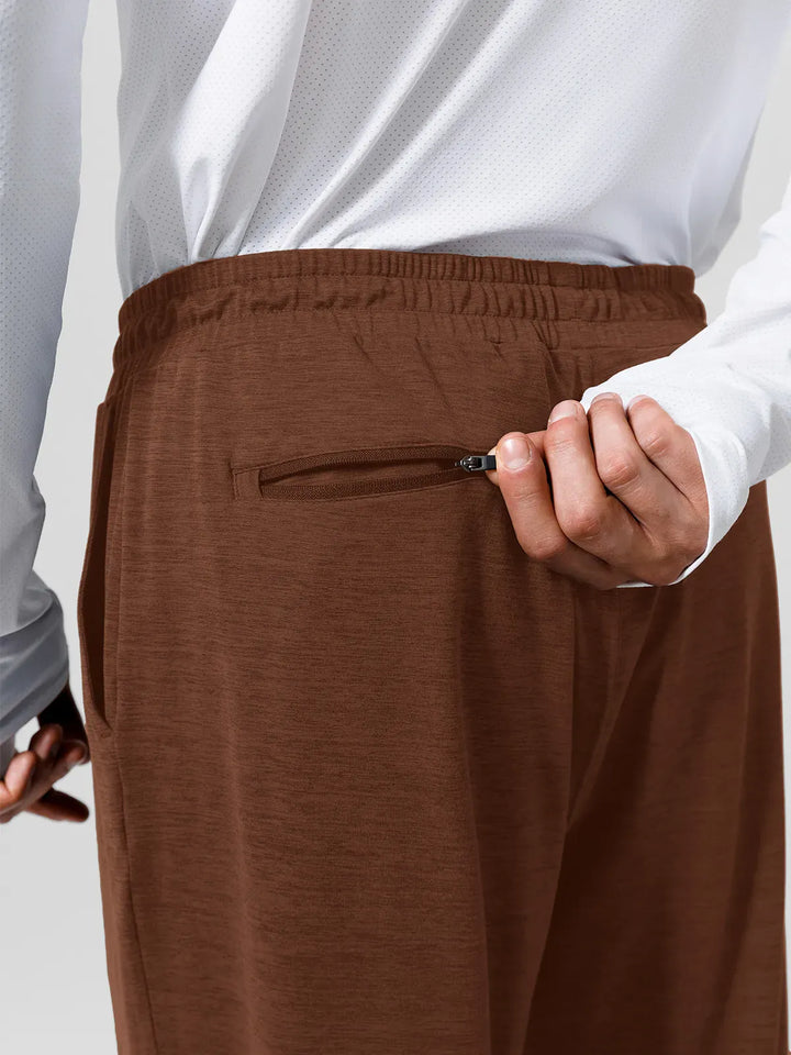 A model wearing a BRXL® Men’s Smooth Four Pockets Tapered Joggers in