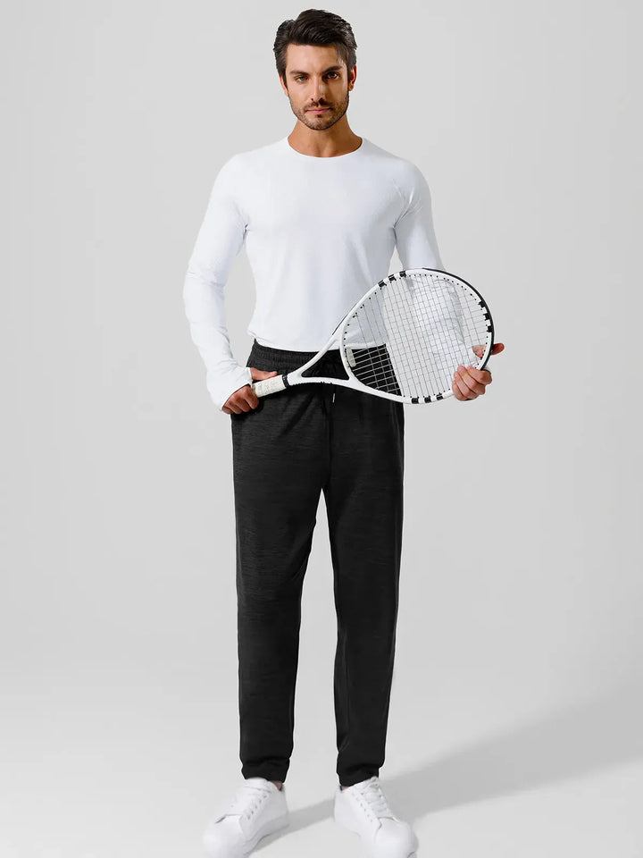 A model wearing a BRXL® Men’s Smooth Four Pockets Tapered Joggers in