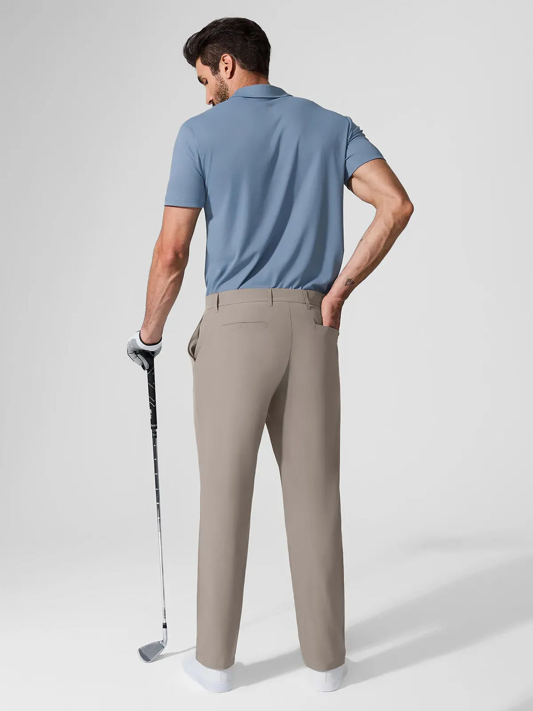 A model wearing a BRXL® Men’s Straight Leg Golf Pants in