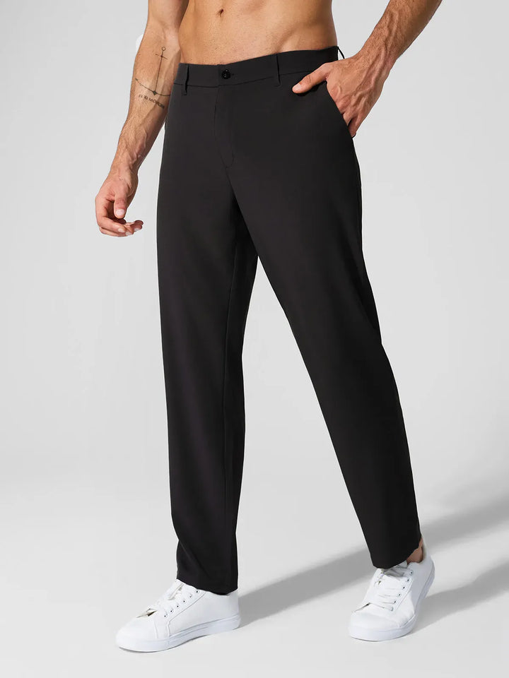 A model wearing a BRXL® Men’s Straight Leg Golf Pants in