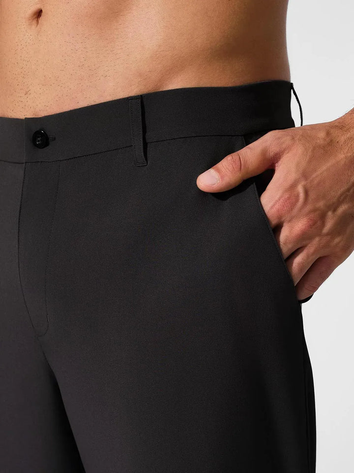 A model wearing a BRXL® Men’s Straight Leg Golf Pants in