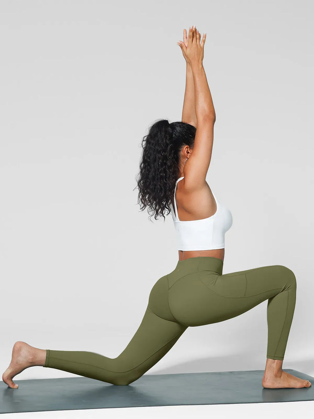 A model wearing a BRXL® One Size Fits Most Sporty High-Waisted Leggings in