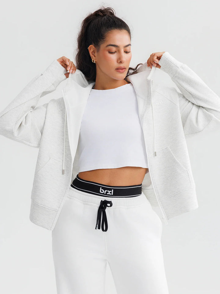 A model wearing a BRXL® Oversized Cropped Zip-Up Comfort Hoodie