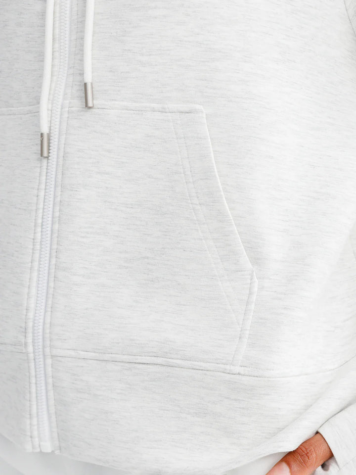 A model wearing a BRXL® Oversized Cropped Zip-Up Comfort Hoodie