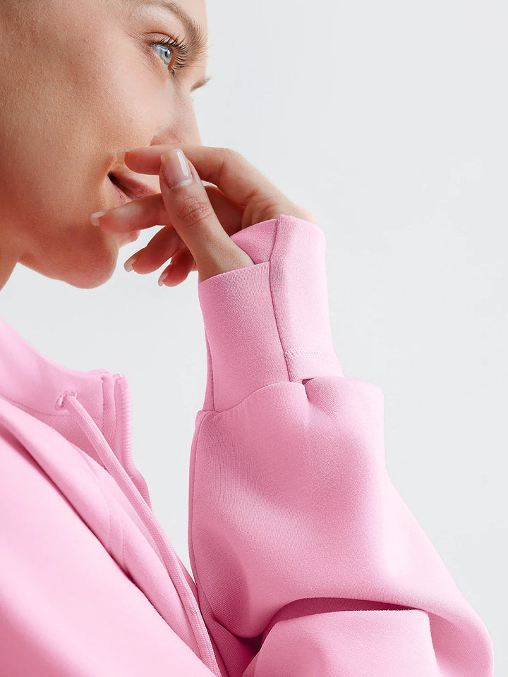 A model wearing a BRXL® Oversized Cropped Zip-Up Comfort Hoodie