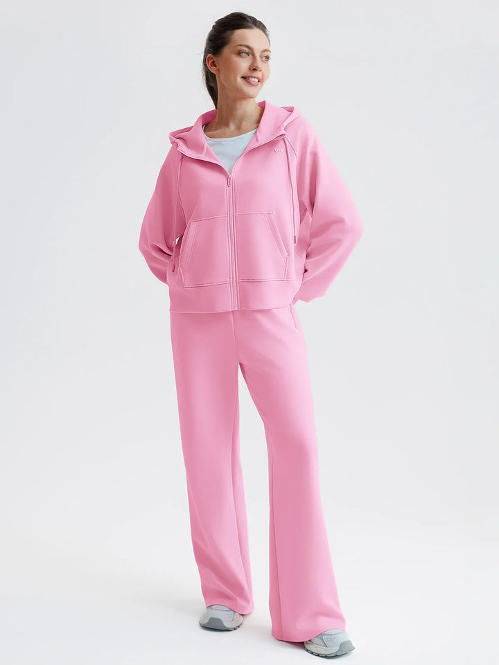 A model wearing a BRXL® Oversized Cropped Zip-Up Comfort Hoodie