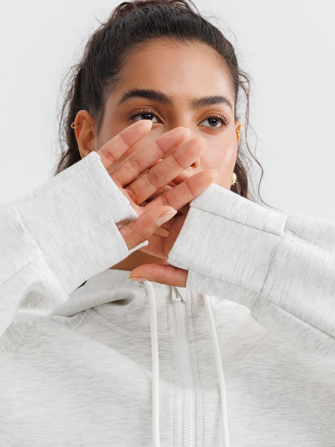 A model wearing a BRXL® Oversized Cropped Zip-Up Comfort Hoodie