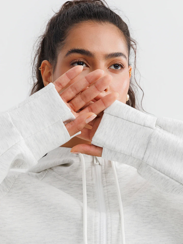 A model wearing a BRXL® Oversized Cropped Zip-Up Comfort Hoodie