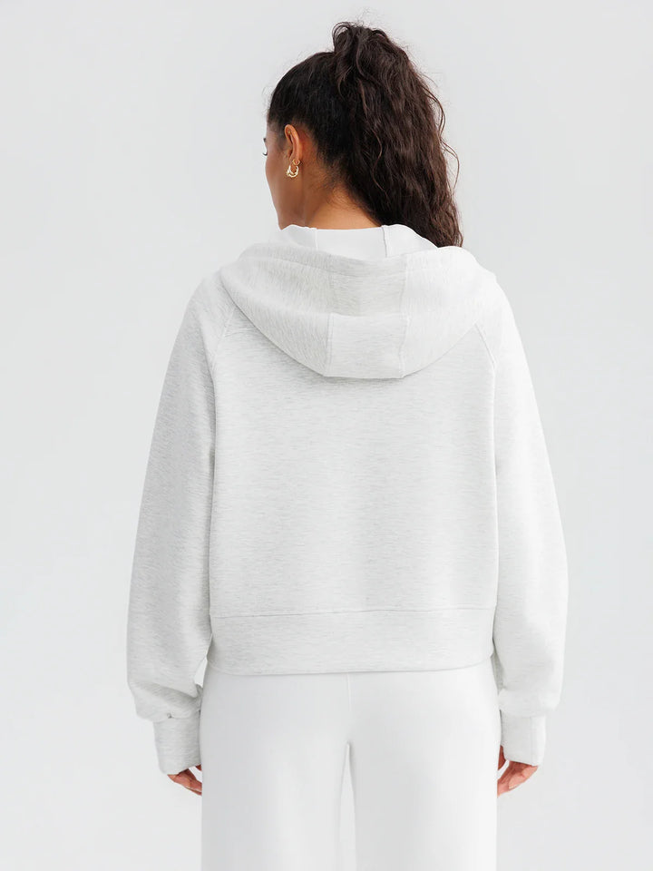 A model wearing a BRXL® Oversized Cropped Zip-Up Comfort Hoodie