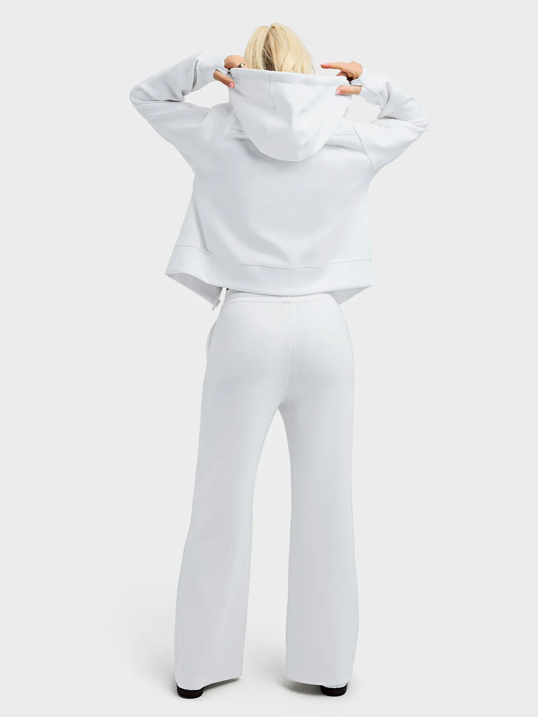 A model wearing a BRXL® Oversized Cropped Zip-Up Comfort Hoodie