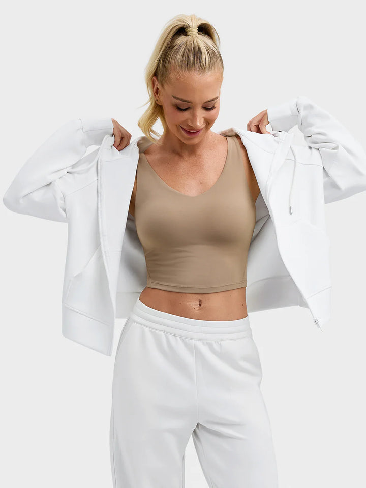 A model wearing a BRXL® Oversized Cropped Zip-Up Comfort Hoodie