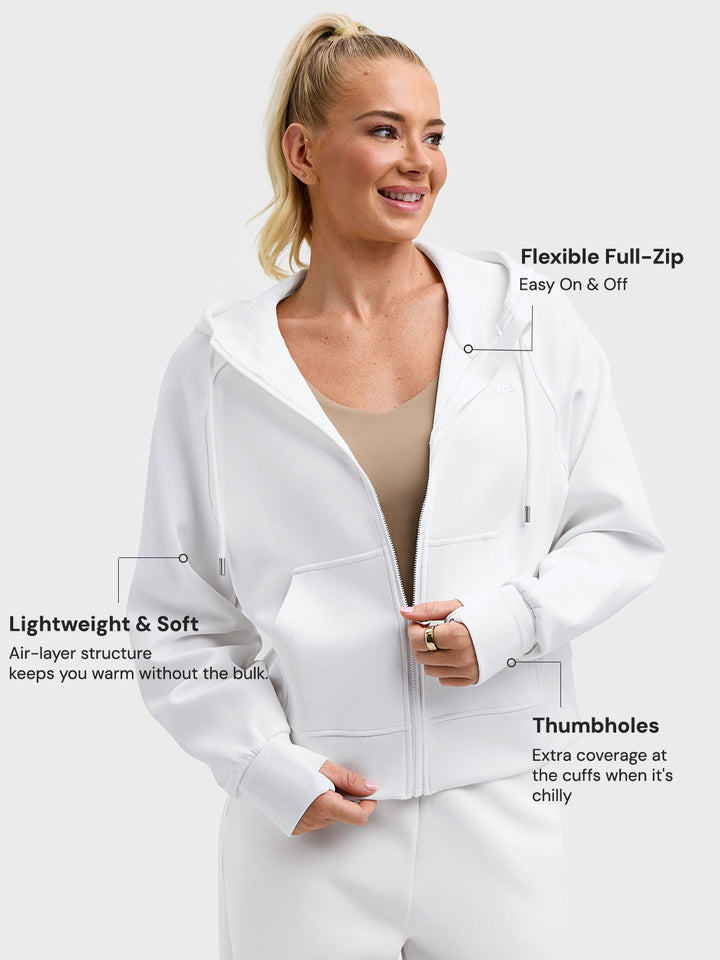 A model wearing a BRXL® Oversized Cropped Zip-Up Comfort Hoodie