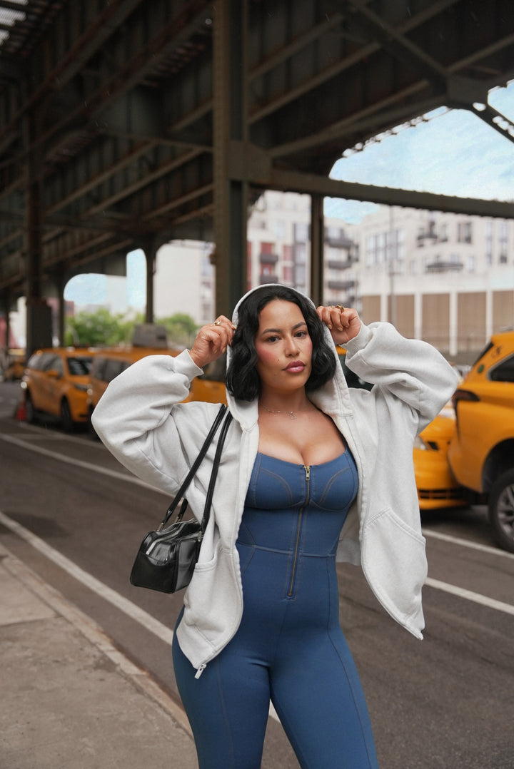 A model wearing a BRXL® Oversized Cropped Zip-Up Comfort Hoodie