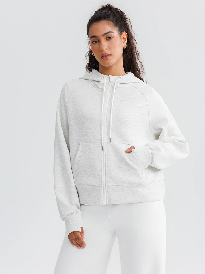 A model wearing a BRXL® Oversized Cropped Zip-Up Comfort Hoodie Charcoal Grey / XS