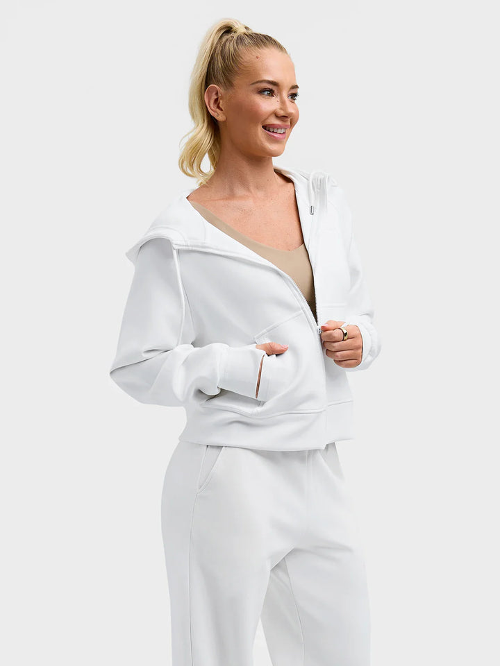 A model wearing a BRXL® Oversized Cropped Zip-Up Comfort Hoodie White / XS