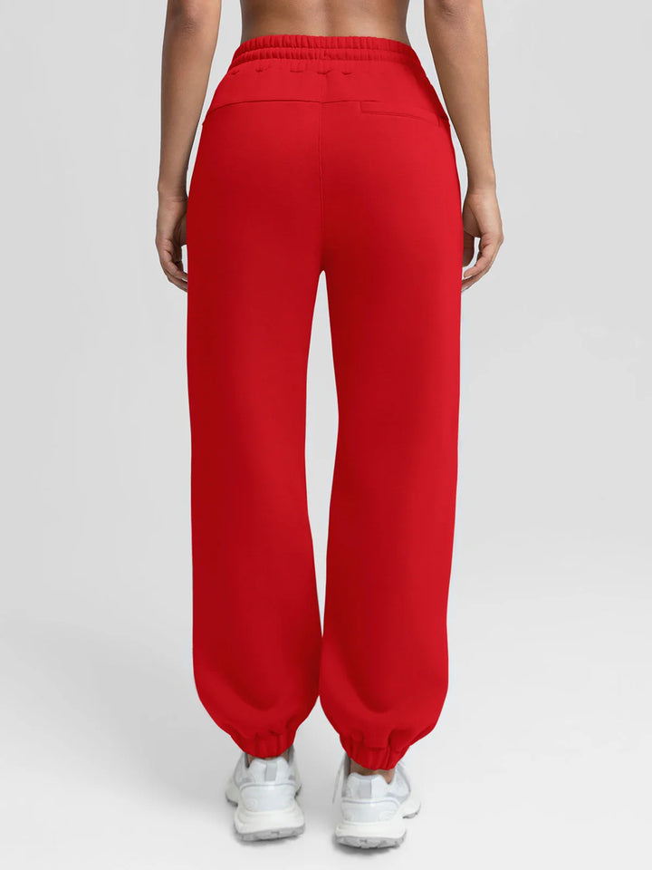 A model wearing a BRXL® Oversized Fleece Travel Jogger Sweatpants with Pockets