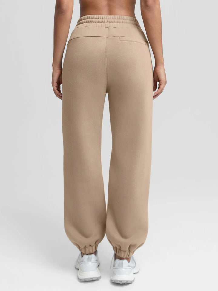 A model wearing a BRXL® Oversized Fleece Travel Jogger Sweatpants with Pockets