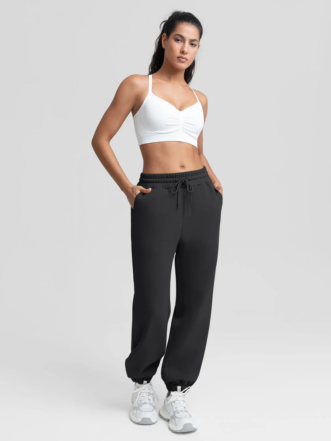A model wearing a BRXL® Oversized Fleece Travel Jogger Sweatpants with Pockets