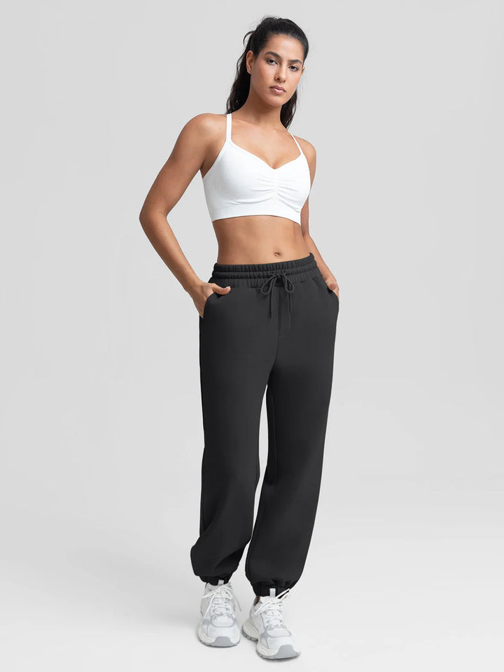 A model wearing a BRXL® Oversized Fleece Travel Jogger Sweatpants with Pockets
