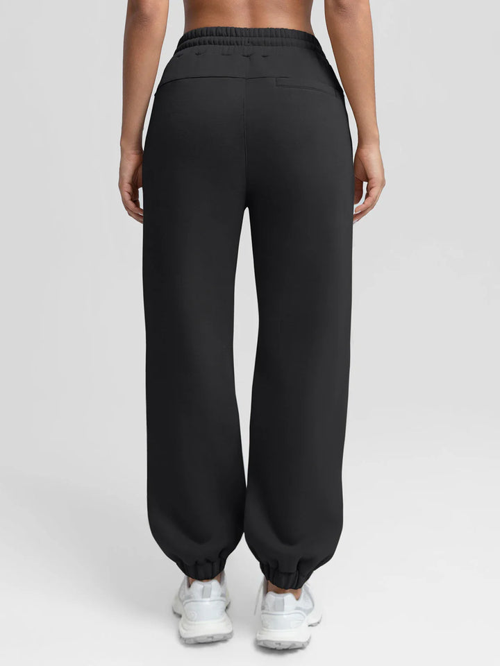 A model wearing a BRXL® Oversized Fleece Travel Jogger Sweatpants with Pockets