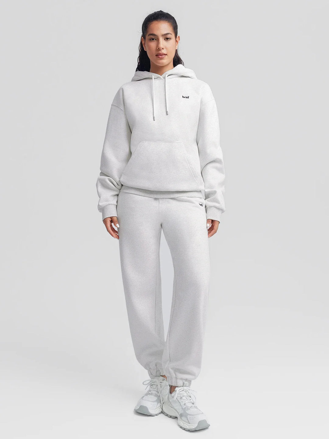 A model wearing a BRXL® Oversized Fleece Travel Jogger Sweatpants with Pockets