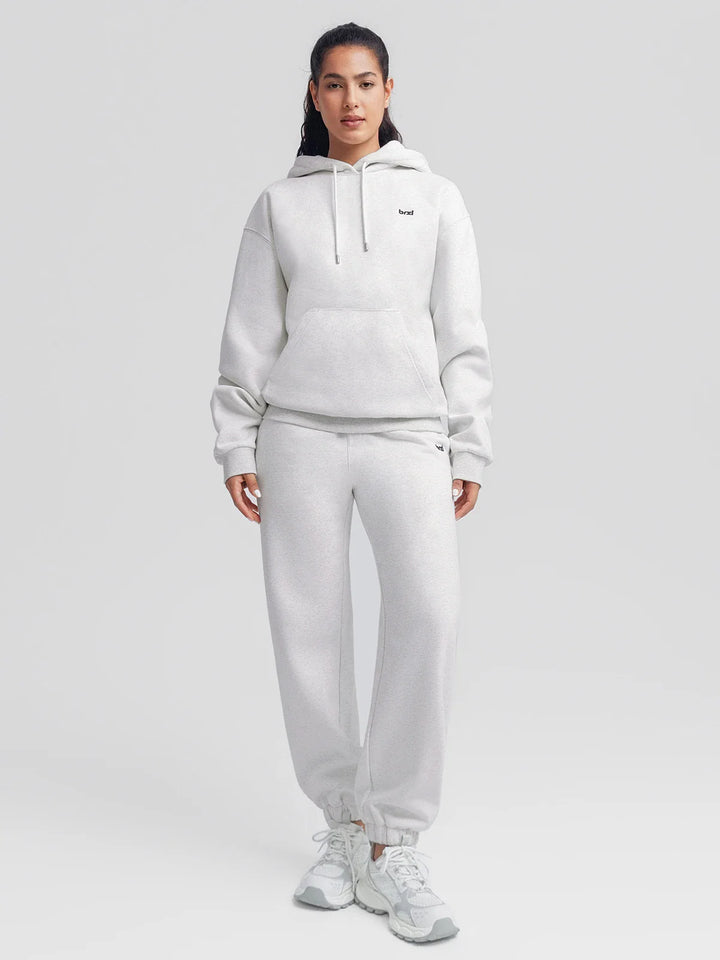 A model wearing a BRXL® Oversized Fleece Travel Jogger Sweatpants with Pockets