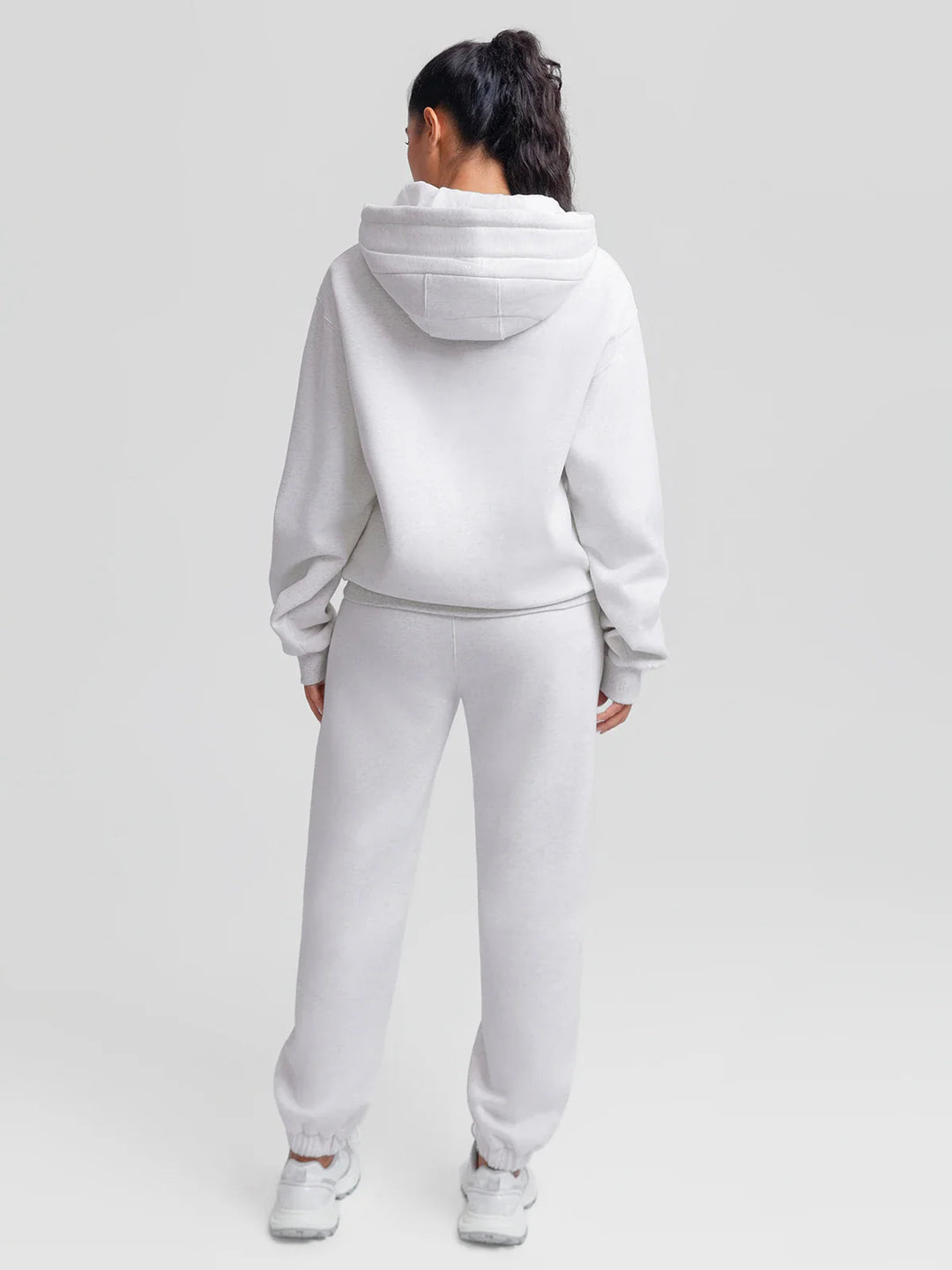 A model wearing a BRXL® Oversized Fleece Travel Jogger Sweatpants with Pockets
