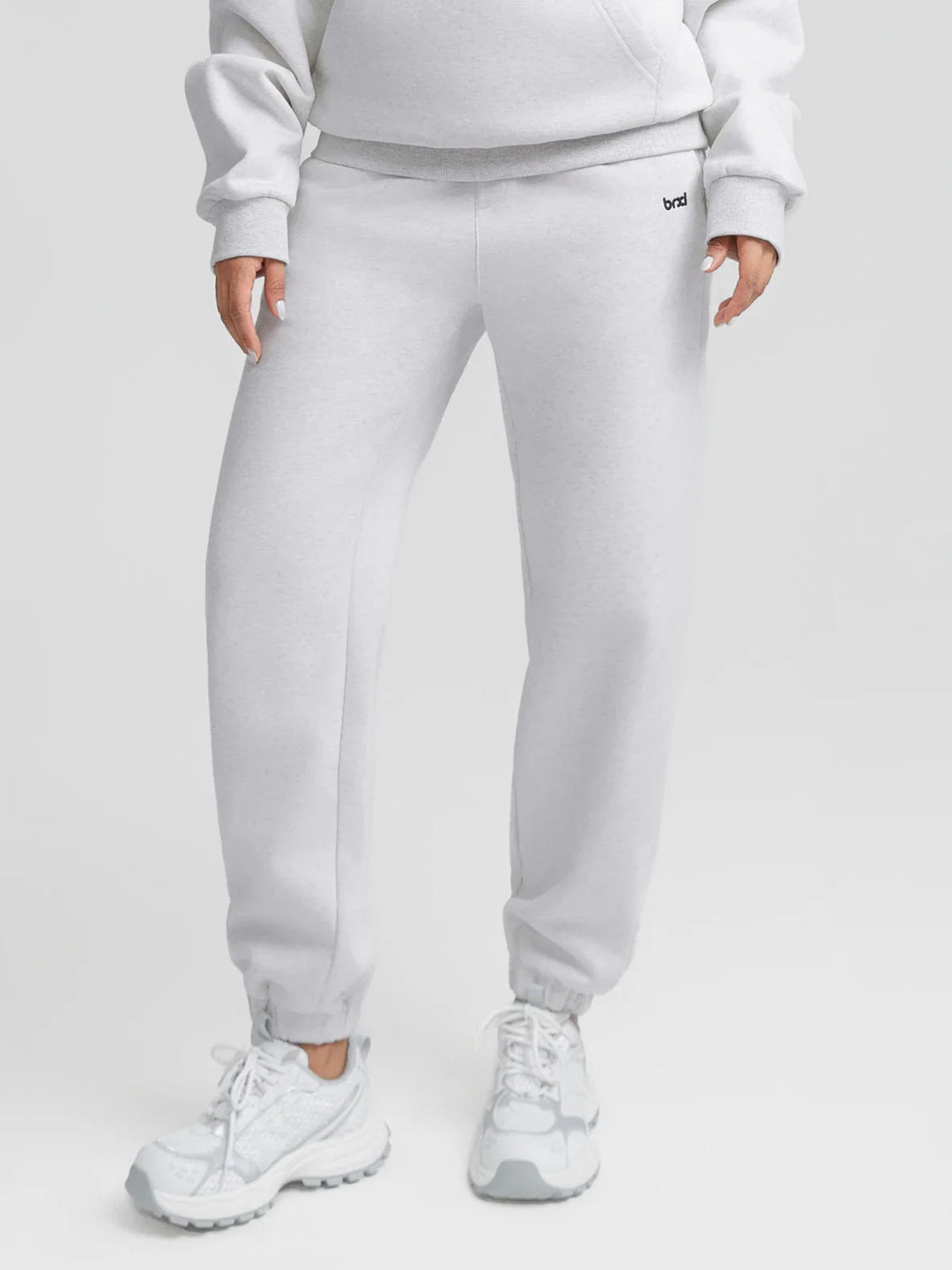 A model wearing a BRXL® Oversized Fleece Travel Jogger Sweatpants with Pockets Marble Grey / XS