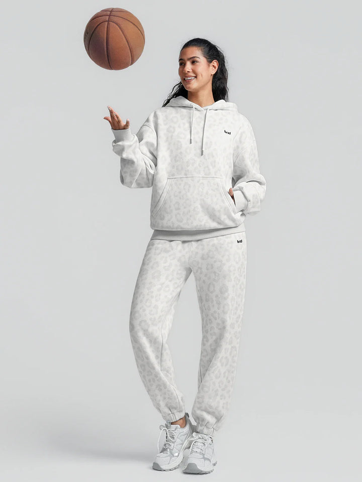 A model wearing a BRXL® Oversized Travel Pullover Hoodie with Headphone Slot
